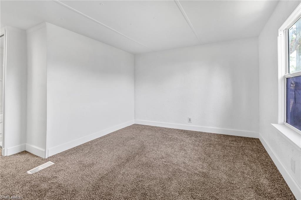 120 Grassy Key Lane, Unit 38 Naples, FL 34114 - Photo 11 of 28 a view of an empty room and a window