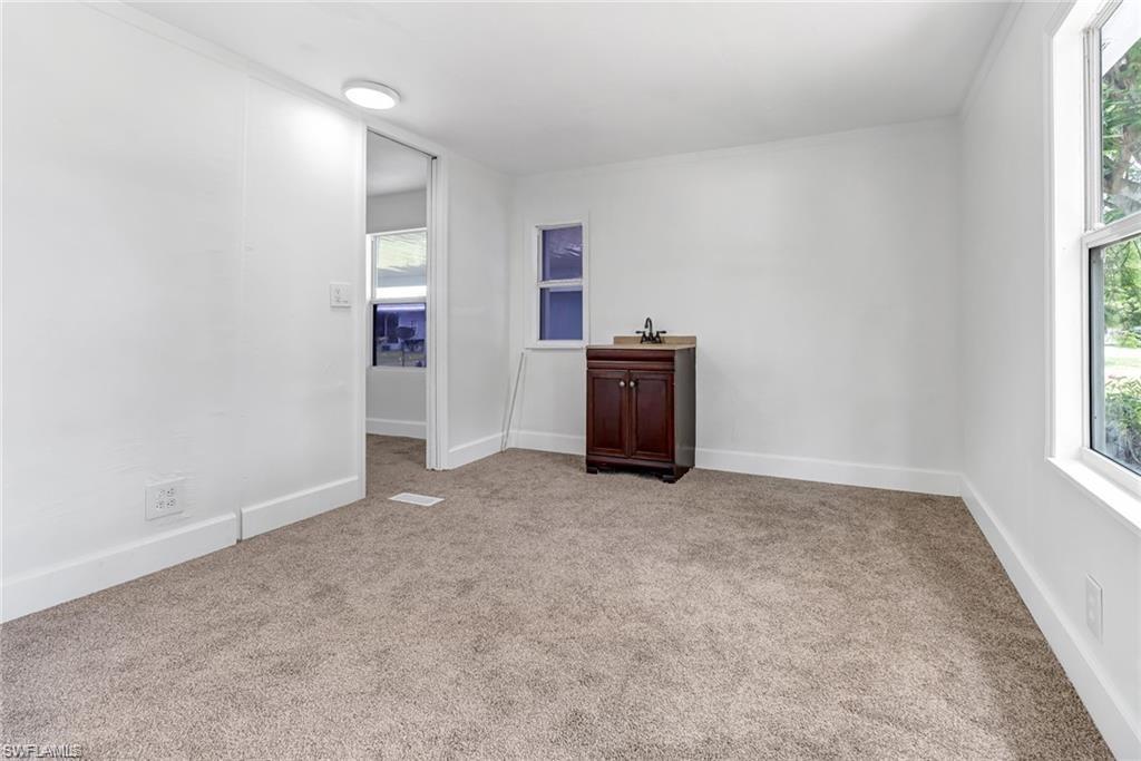 120 Grassy Key Lane, Unit 38 Naples, FL 34114 - Photo 13 of 28 an empty room with windows