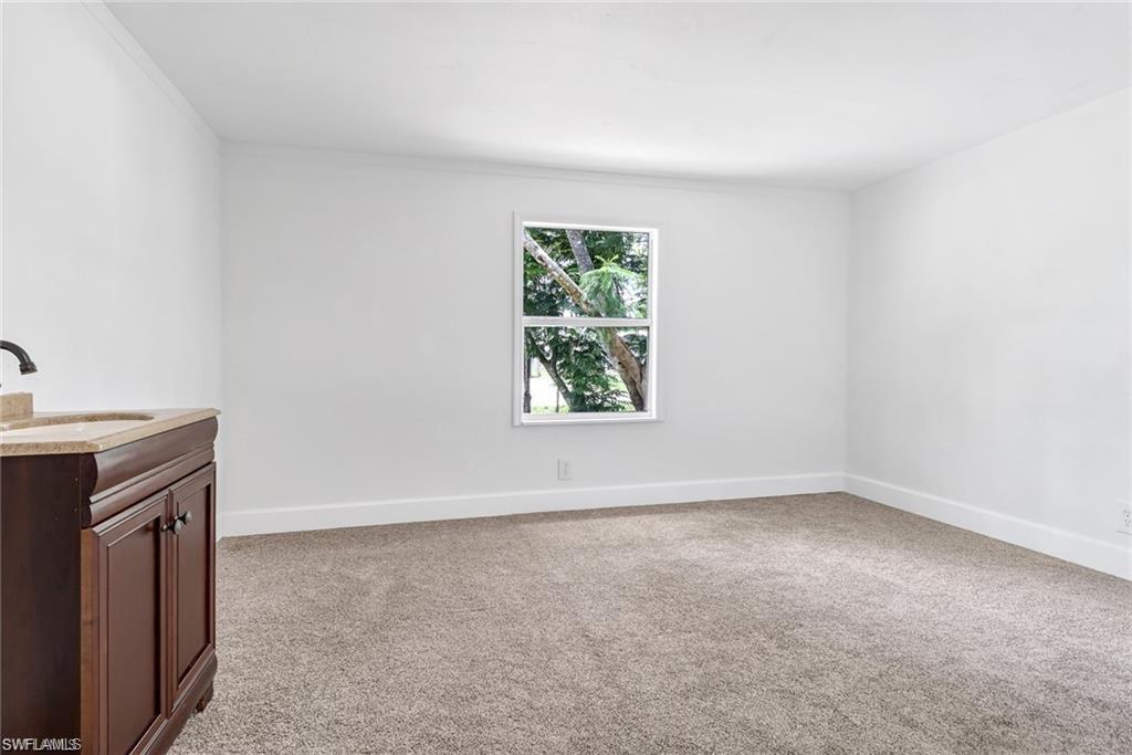 120 Grassy Key Lane, Unit 38 Naples, FL 34114 - Photo 14 of 28 an empty room with windows