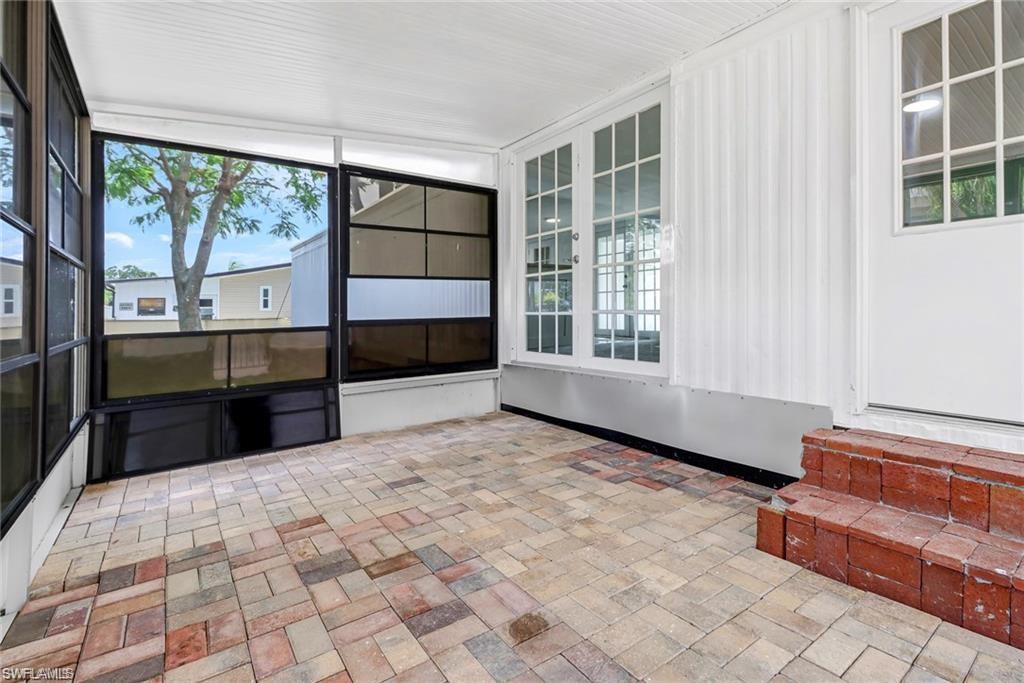 120 Grassy Key Lane, Unit 38 Naples, FL 34114 - Photo 15 of 28 a view of empty room with windows