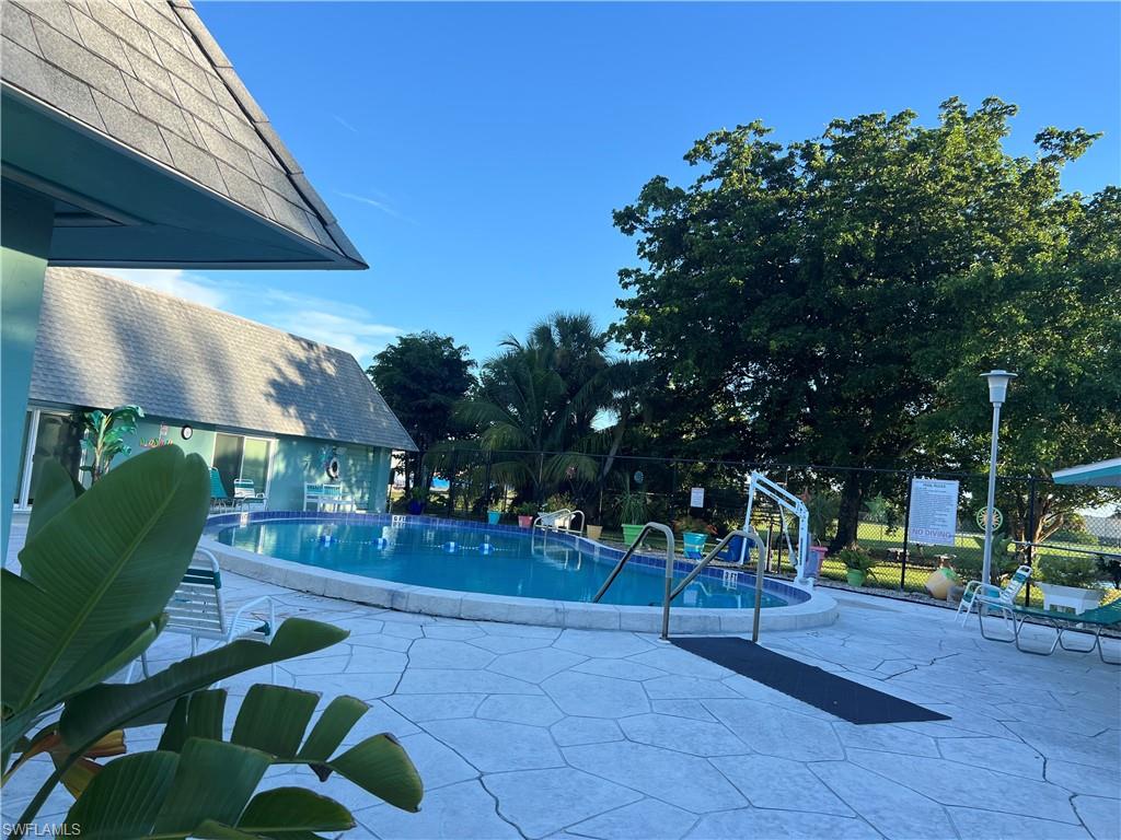 120 Grassy Key Lane, Unit 38 Naples, FL 34114 - Photo 20 of 28 a view of outdoor space with garden and entertaining space