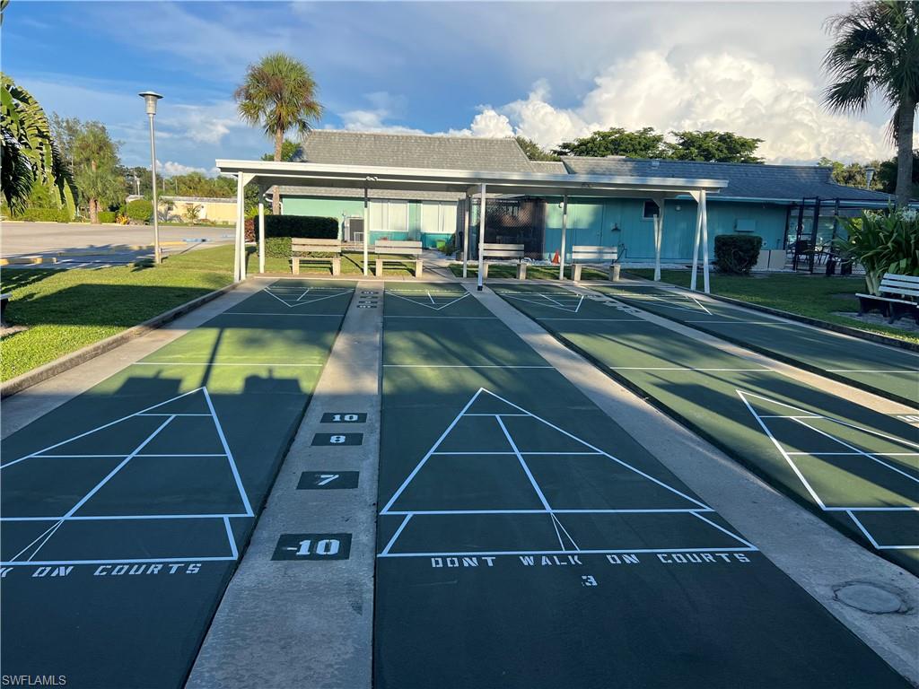 120 Grassy Key Lane, Unit 38 Naples, FL 34114 - Photo 23 of 28 a view of a house with backyard porch and sitting area