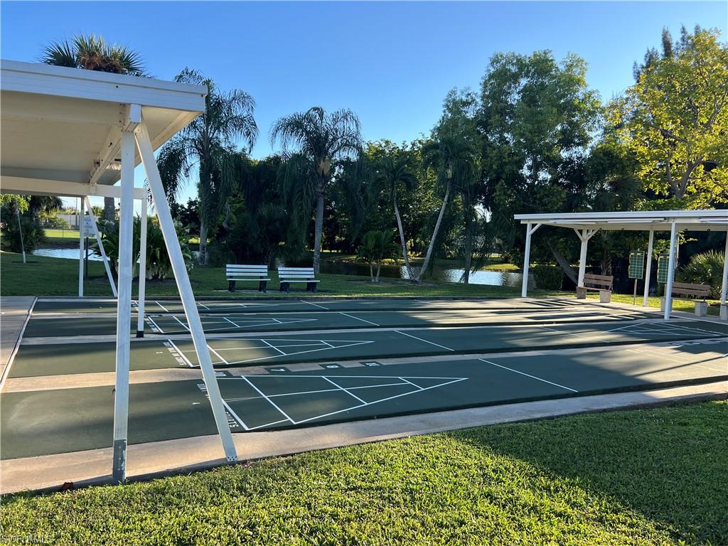 120 Grassy Key Lane, Unit 38 Naples, FL 34114 - Photo 24 of 28 swimming pool view with a garden space