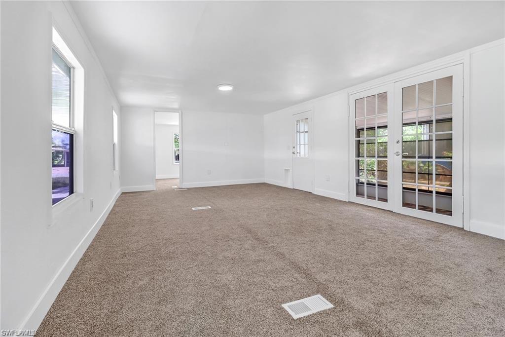 120 Grassy Key Lane, Unit 38 Naples, FL 34114 - Photo 7 of 28 an empty room with windows