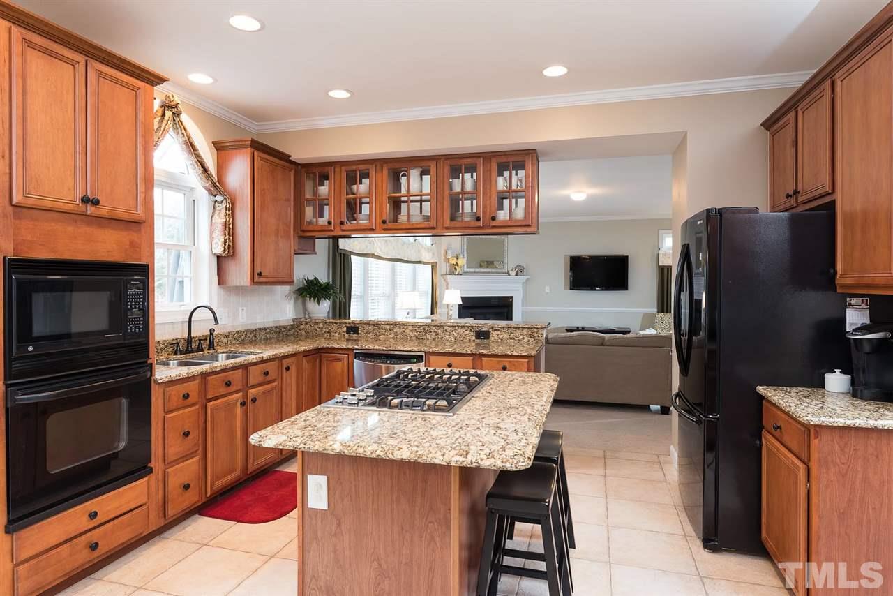 12301 Fieldmist Drive Raleigh, NC 27614 - Photo 8 of 25 The cook in your home will love this kitchen! So much space! Granite countertops! Kitchen Island. Gas Cook top. Wall oven with microwave.