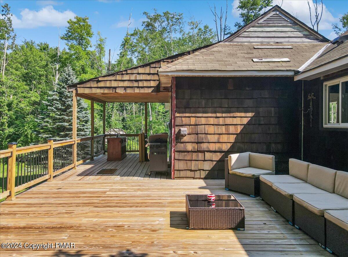 188 Olde Schoolhouse Road Cresco, PA 18326 - Photo 11 of 62 a view of a patio with couches chairs and wooden floor