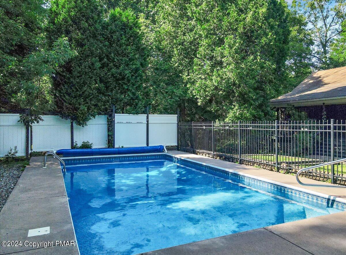 188 Olde Schoolhouse Road Cresco, PA 18326 - Photo 14 of 62 a view of a swimming pool with a patio