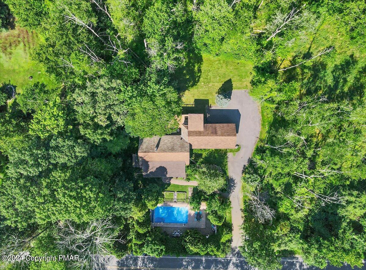 188 Olde Schoolhouse Road Cresco, PA 18326 - Photo 15 of 62 an aerial view of a house with a yard fountain and large tree