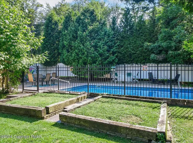 a kitchen with stainless steel appliances a stove sink microwave and cabinets