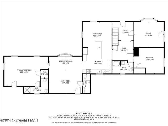 a large kitchen with kitchen island a sink table and chairs