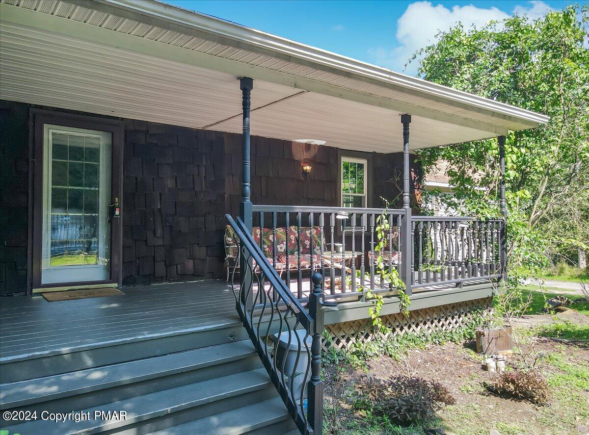 188 Olde Schoolhouse Road Cresco, PA 18326 - Photo 2 of 62 a view of porch with a small yard