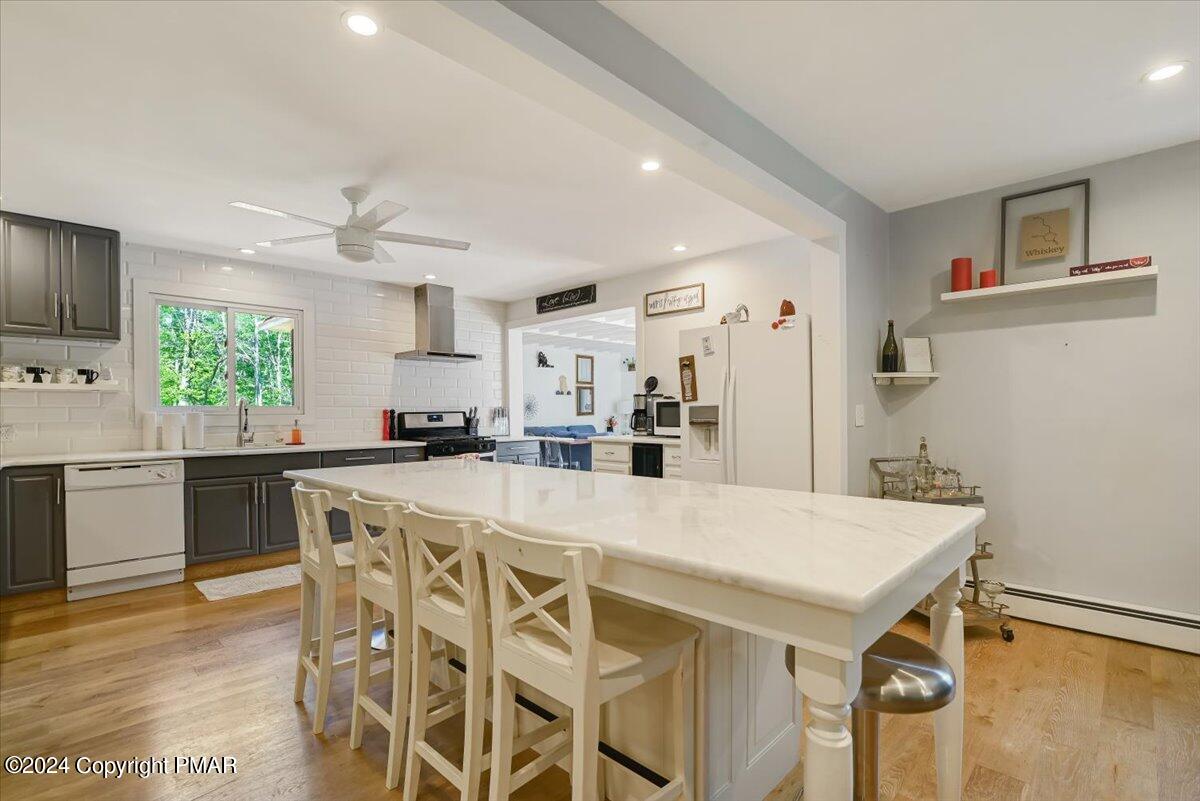 188 Olde Schoolhouse Road Cresco, PA 18326 - Photo 25 of 62 a kitchen with stainless steel appliances a table and chairs in it