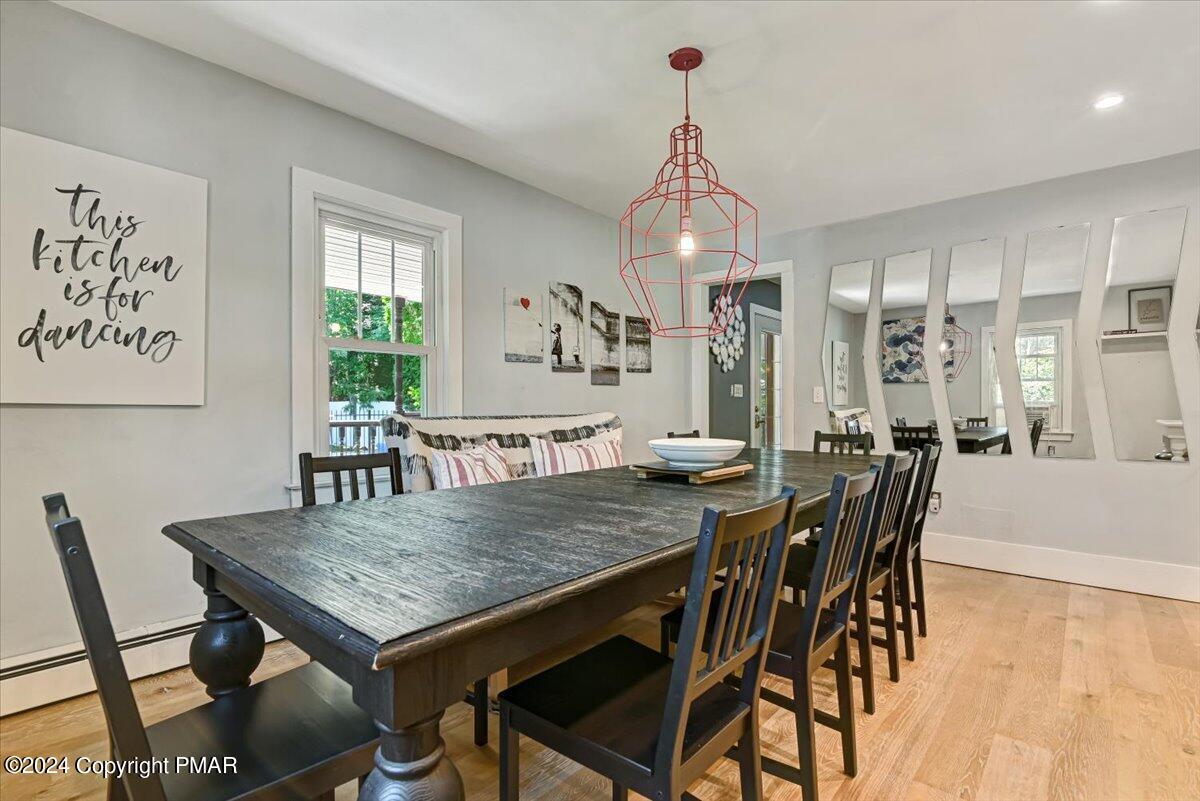188 Olde Schoolhouse Road Cresco, PA 18326 - Photo 26 of 62 a view of a dining table and chairs in a room