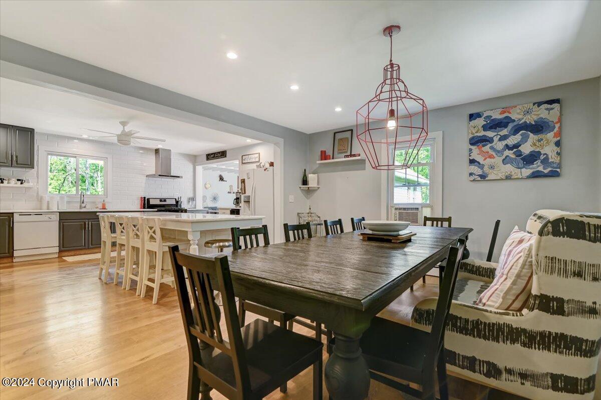 188 Olde Schoolhouse Road Cresco, PA 18326 - Photo 27 of 62 a view of a dining room with furniture and wooden floor