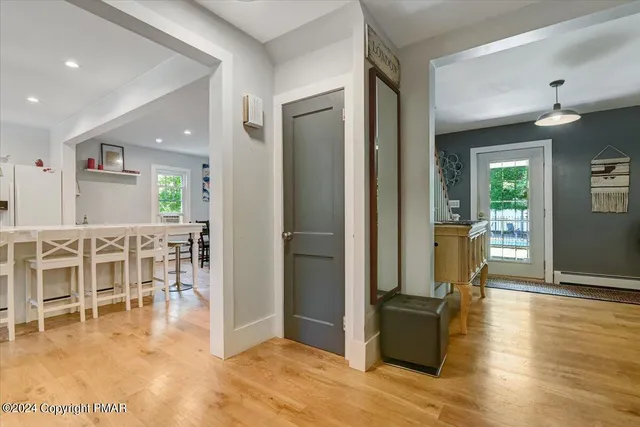 a living room with a table and a large window