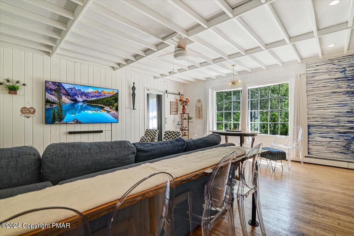 188 Olde Schoolhouse Road Cresco, PA 18326 - Photo 34 of 62 a view of a dining room with furniture wooden floor and a chandelier