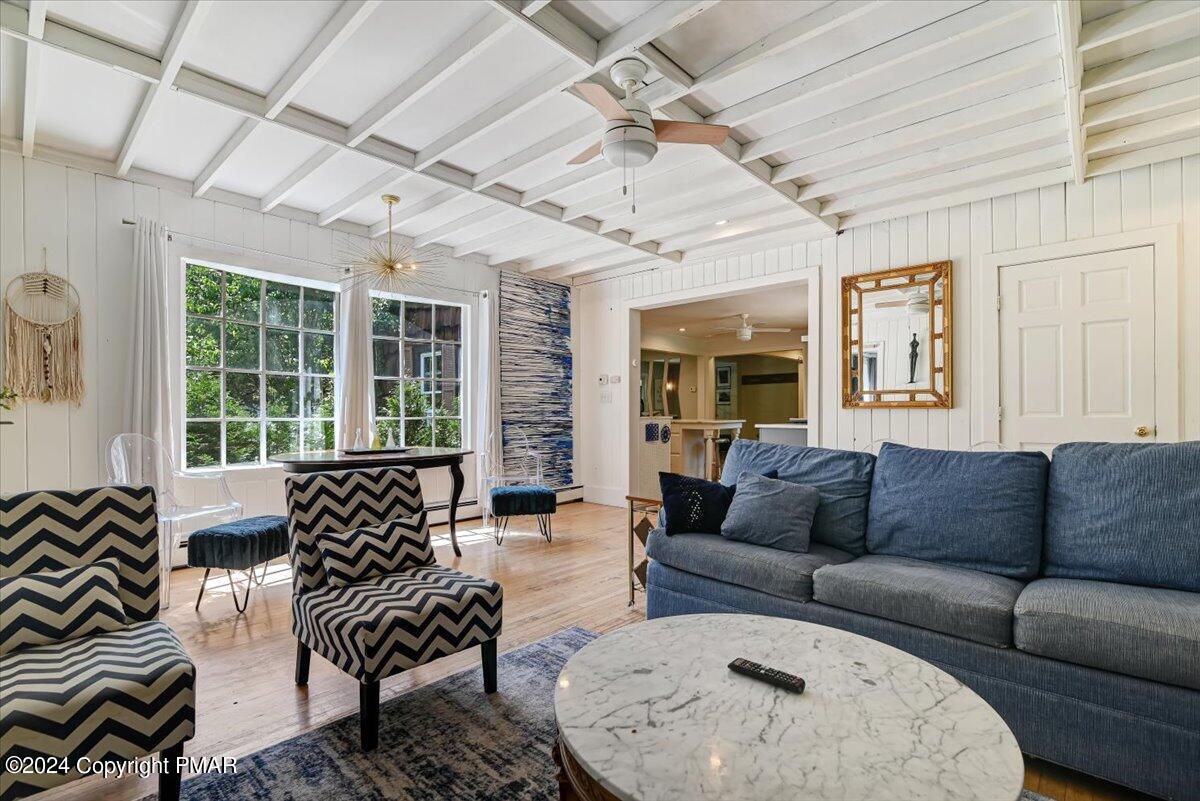 188 Olde Schoolhouse Road Cresco, PA 18326 - Photo 35 of 62 a living room with furniture and a large window