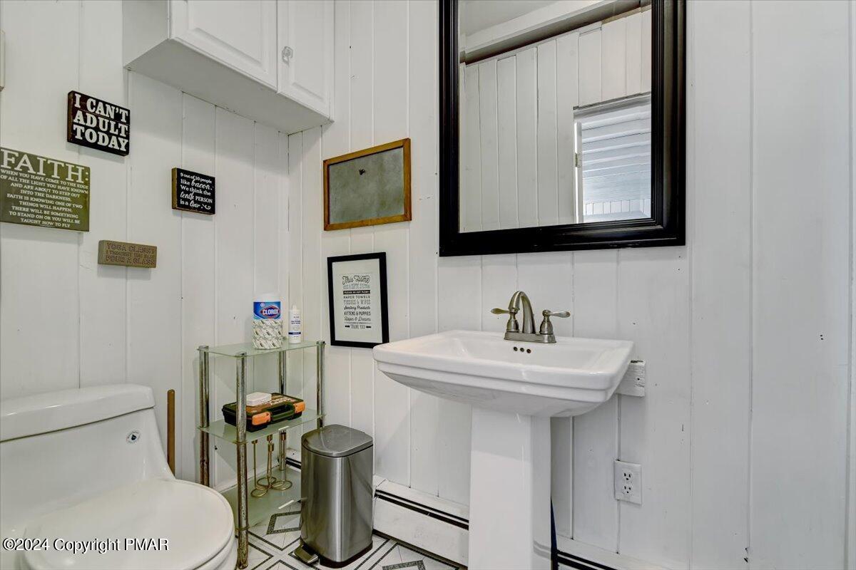 188 Olde Schoolhouse Road Cresco, PA 18326 - Photo 37 of 62 a bathroom with a sink mirror and toilet