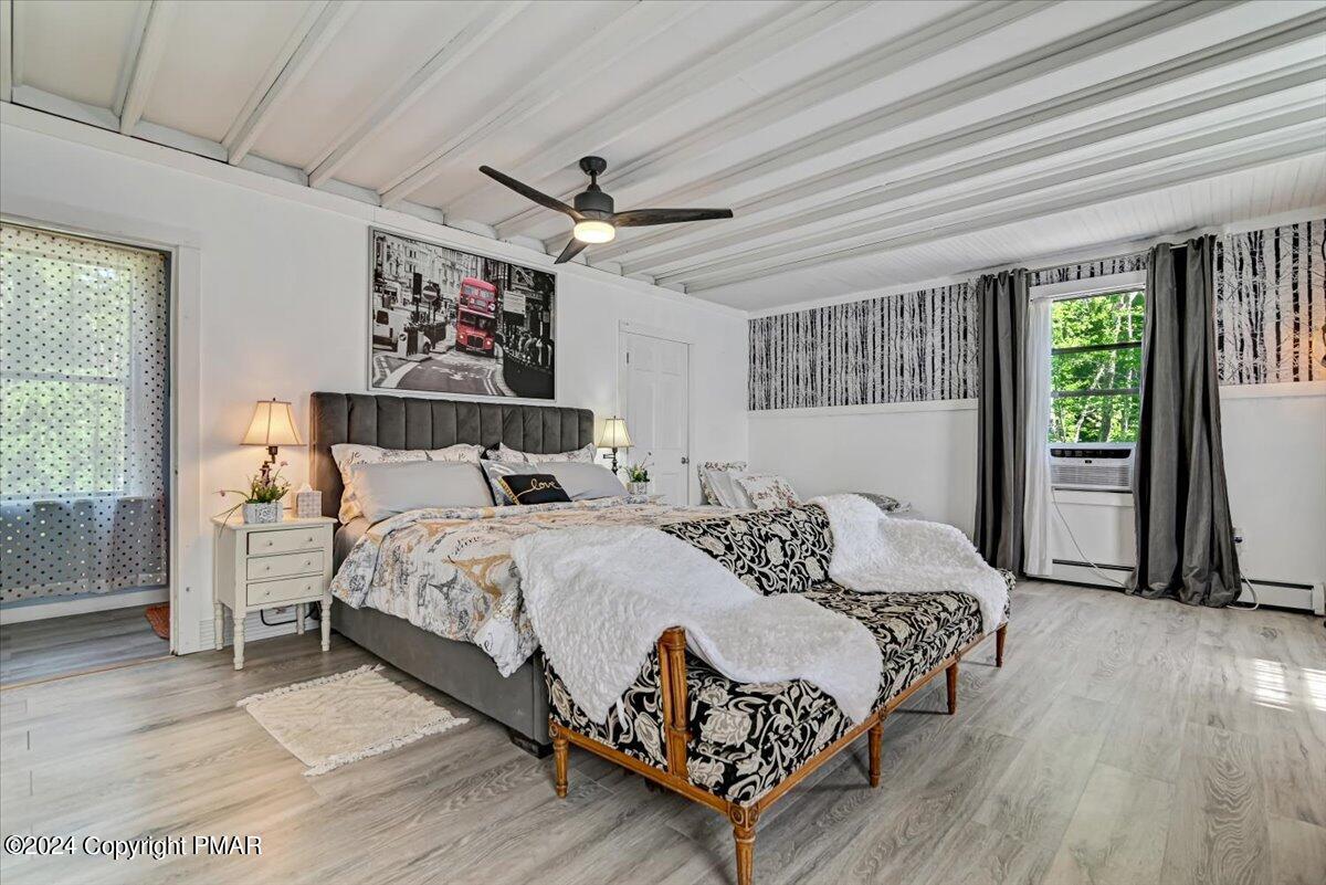 188 Olde Schoolhouse Road Cresco, PA 18326 - Photo 40 of 62 a bedroom with a large bed and a window