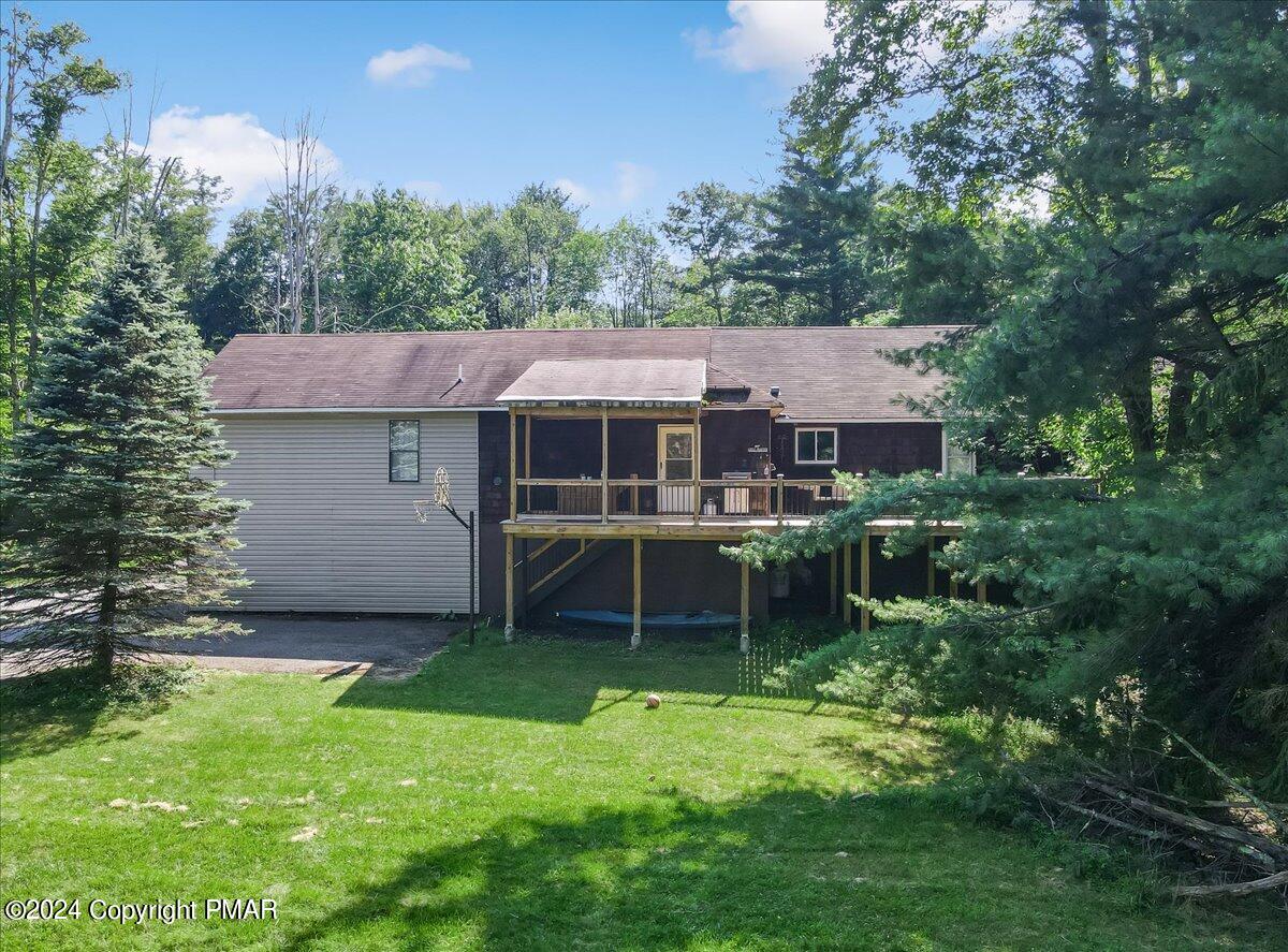 188 Olde Schoolhouse Road Cresco, PA 18326 - Photo 4 of 62 a view of a house with a yard and sitting area