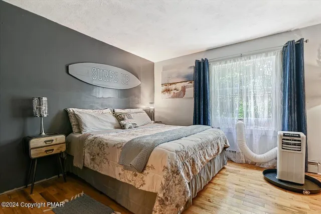 a bedroom with a bed and walk in closet