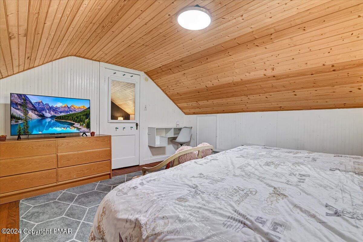 188 Olde Schoolhouse Road Cresco, PA 18326 - Photo 53 of 62 a bedroom with a bed and a dresser