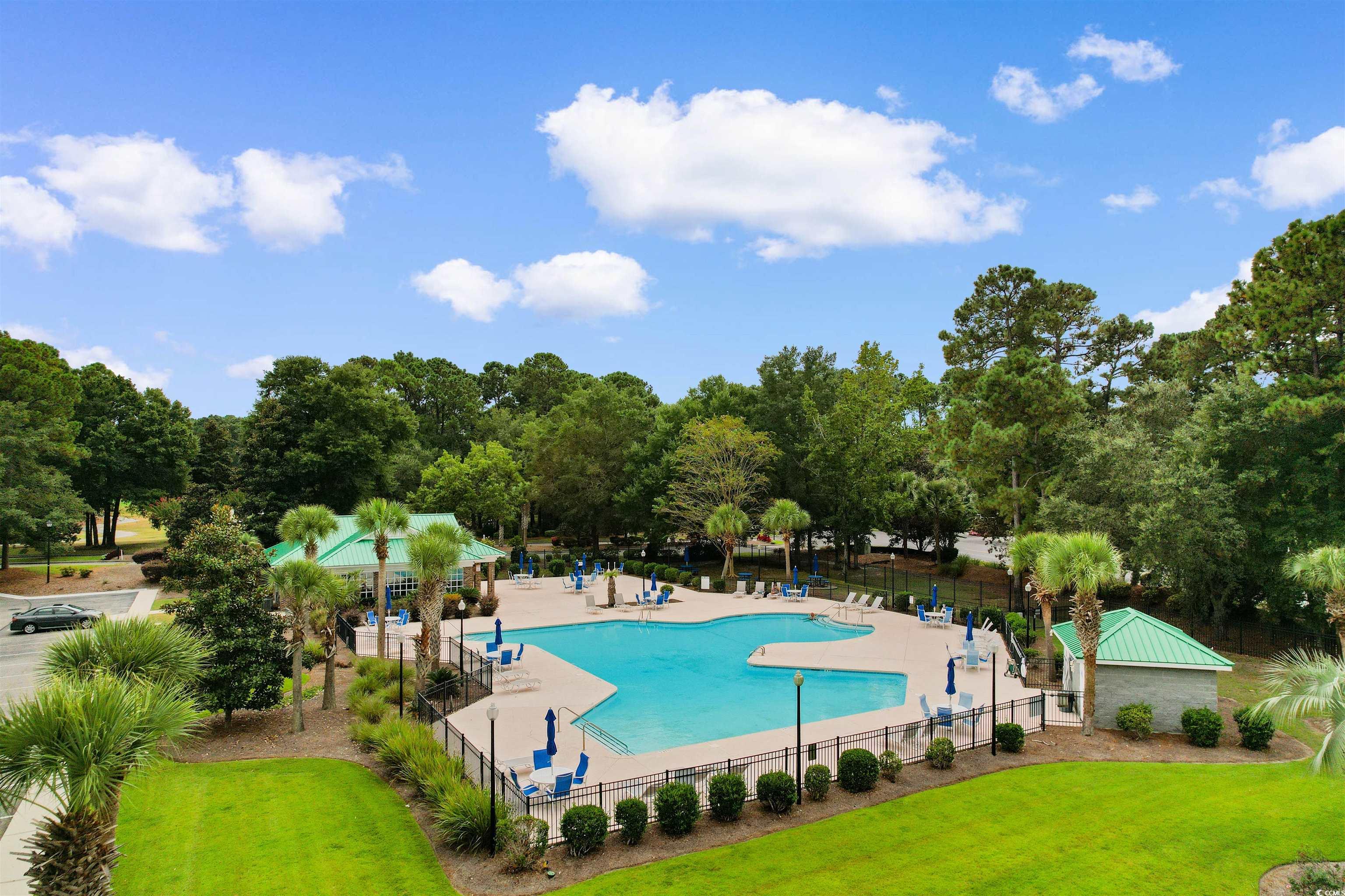 4430 Lady Banks Lane, Unit A2 Murrells Inlet, SC 29576 - Photo 27 of 31 Community pool featuring view of scattered trees and a patio