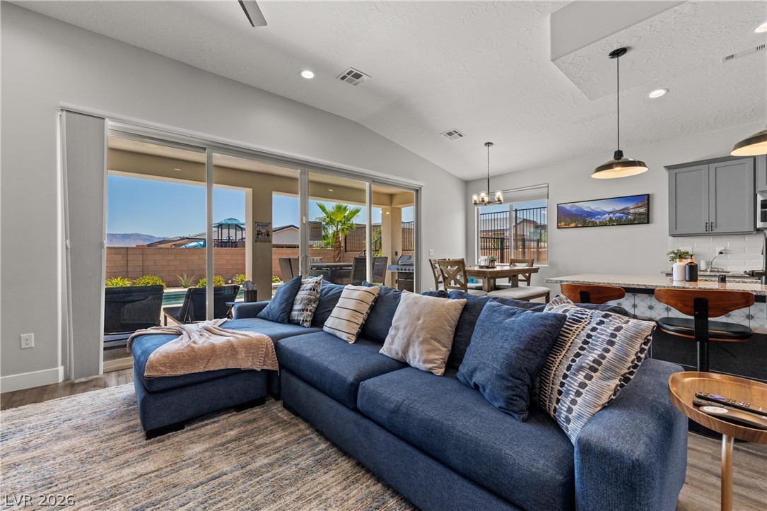 1436 Manassas Ridge Mesquite, NV 89027 - Photo 17 of 77 Sliding glass doors blur the lines between indoor comfort and outdoor leisure, inviting seamless living.