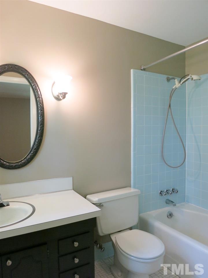 813 Autumn Court Raleigh, NC 27609 - Photo 16 of 25 The Master Bath has a tile floor, tiled tub/shower & NEW lighting.