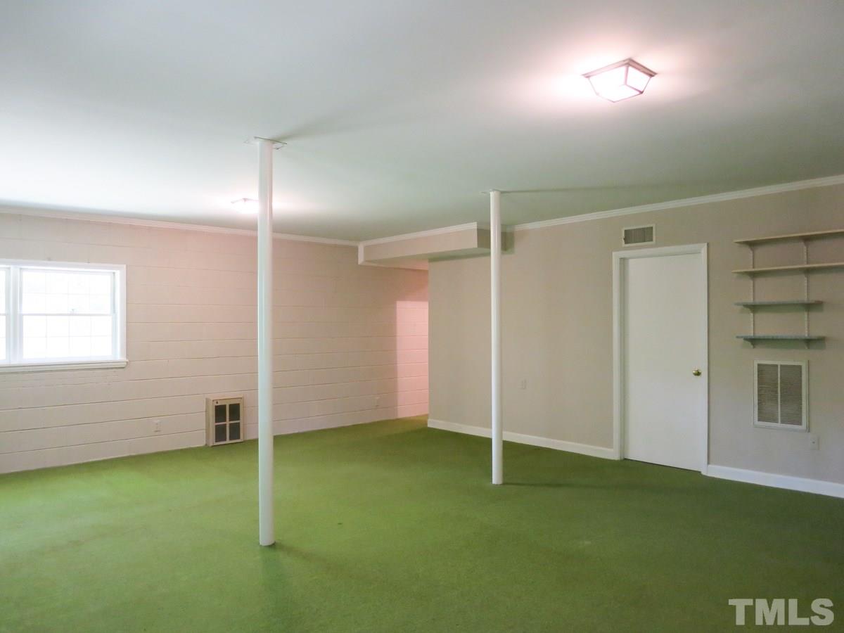 813 Autumn Court Raleigh, NC 27609 - Photo 21 of 25 The finished basement features 9’ smooth ceiling, Laundry Rm/Half Bath combo & big RecRm w/wall heaters; there is tons of storage in walk-up Attic & Basement Storage Rm!