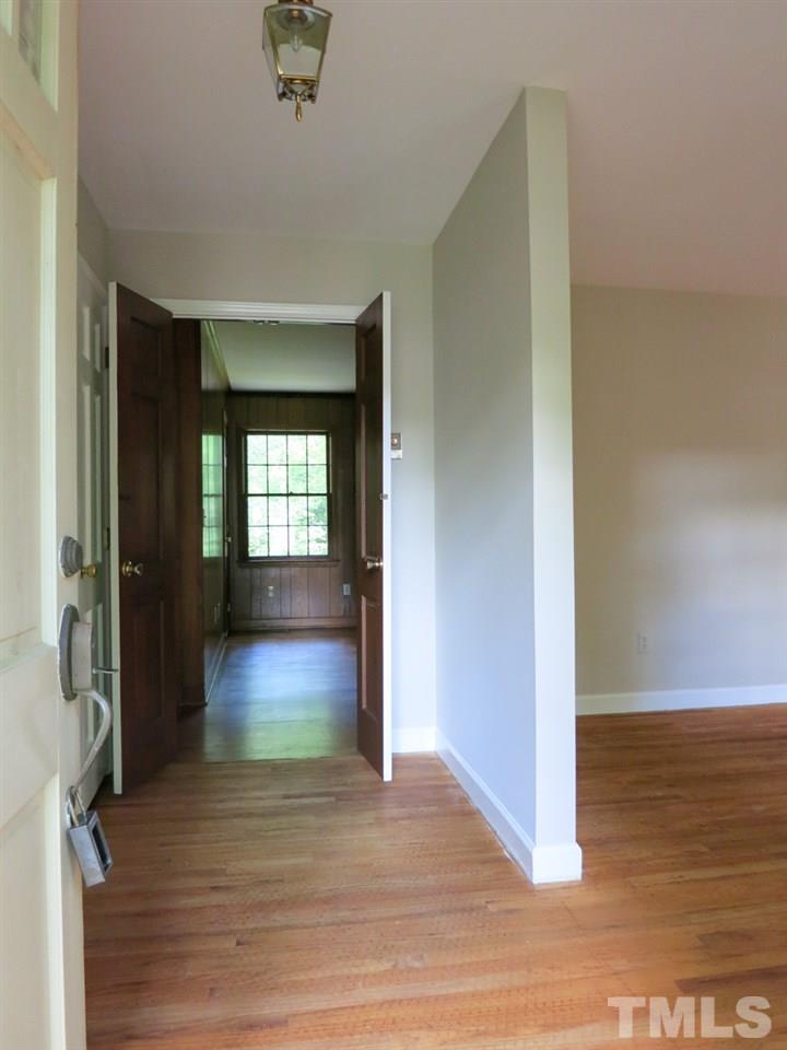 813 Autumn Court Raleigh, NC 27609 - Photo 3 of 25 View of the welcoming Foyer w/coat closet. This home features a 7 yr old HVAC; hardwood flrs throughout except in KIT & Baths; fresh interior paint, NEW SS appls, and NEW Bathroom lighting!