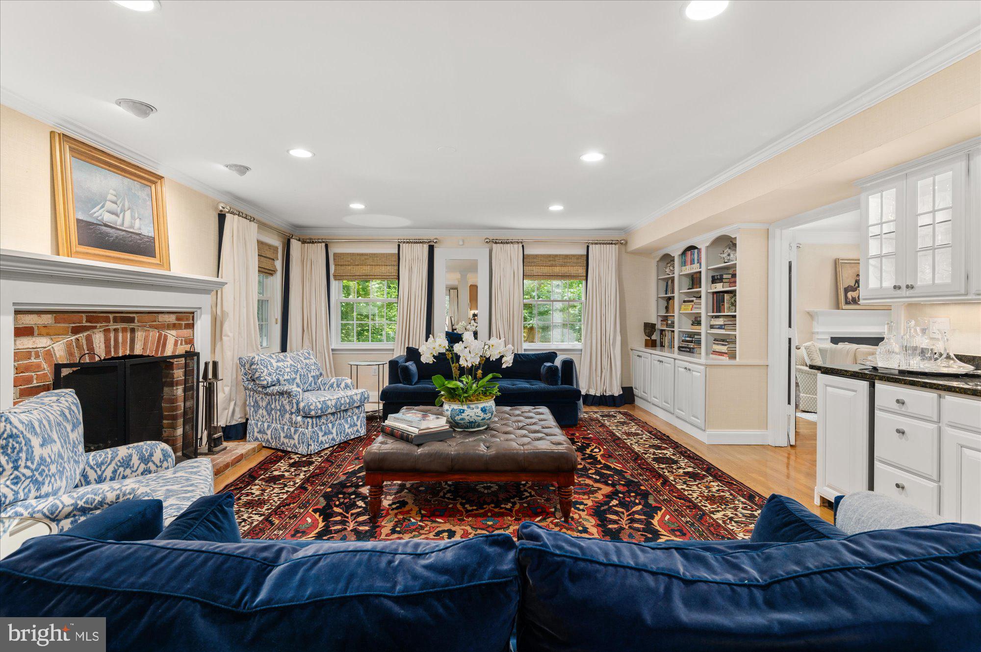7301 River Falls Drive Potomac, MD 20854 - Photo 9 of 48 Large sitting room w/ fireplace, abundant seating