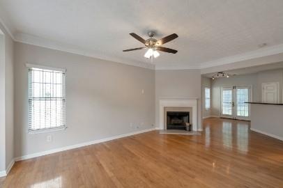 5450 Hampton Court Atlanta, GA 30349 - Photo 2 of 15 a view of empty room with fireplace and wooden floor