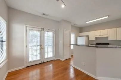 a view of kitchen with stainless steel appliances granite countertop a stove a sink and a window