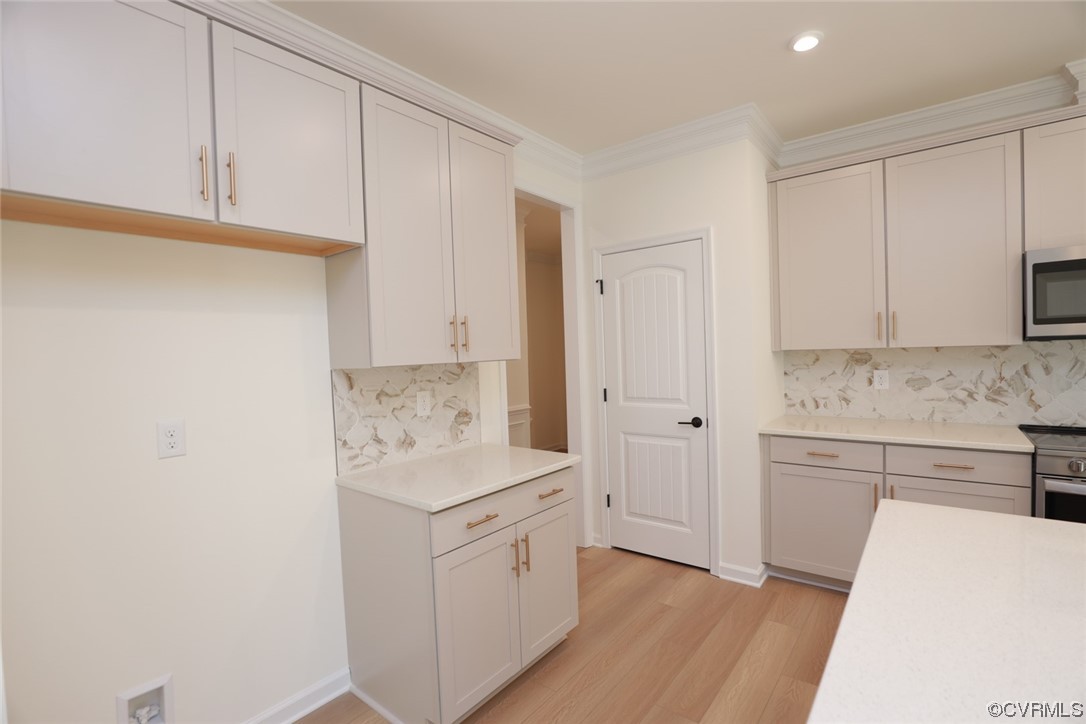 3843 Belspring Road Chester, VA 23831 - Photo 11 of 36 a kitchen with white cabinets and white appliances