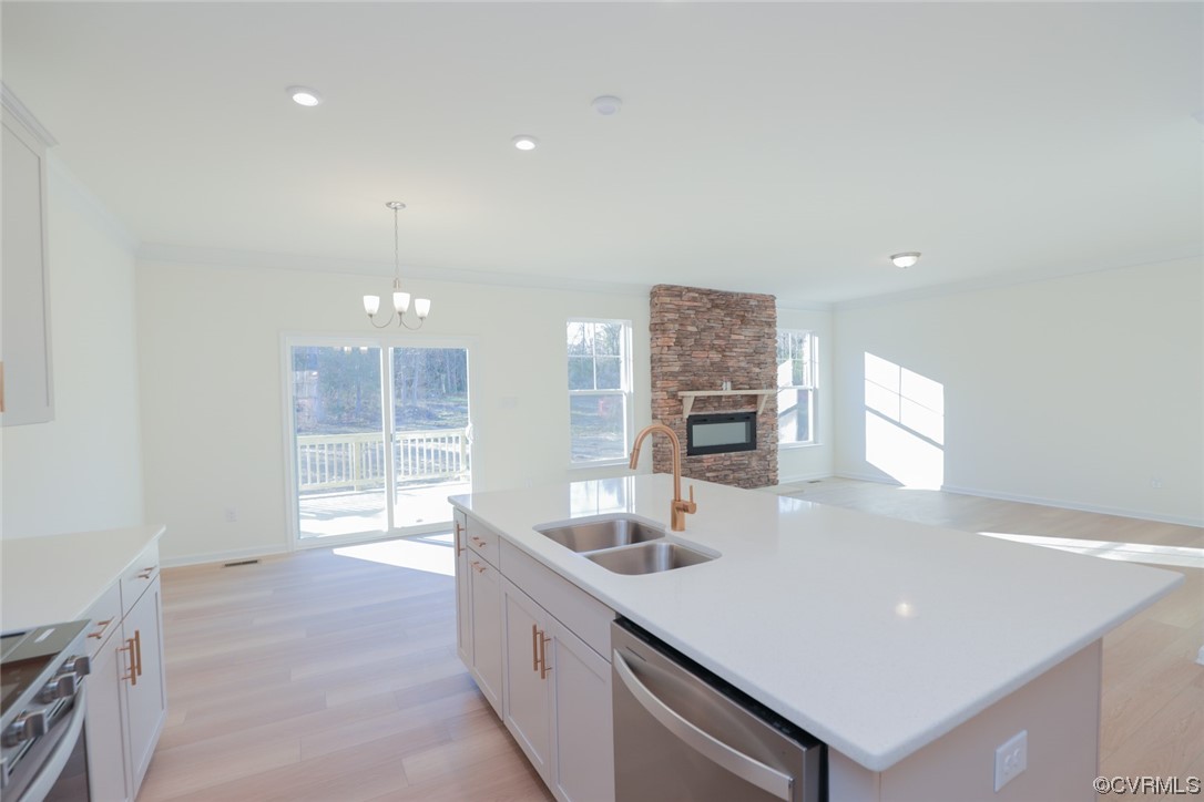 3843 Belspring Road Chester, VA 23831 - Photo 13 of 36 a kitchen with stainless steel appliances a sink and a large window