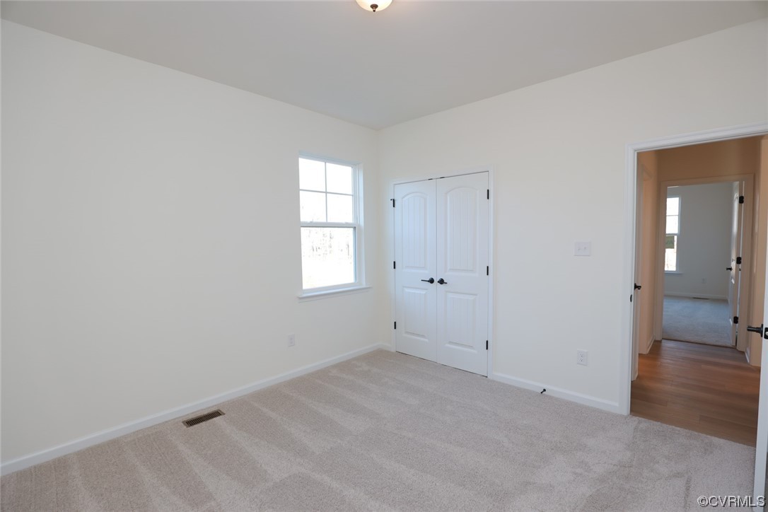 3843 Belspring Road Chester, VA 23831 - Photo 28 of 36 wooden floor and window in an empty room