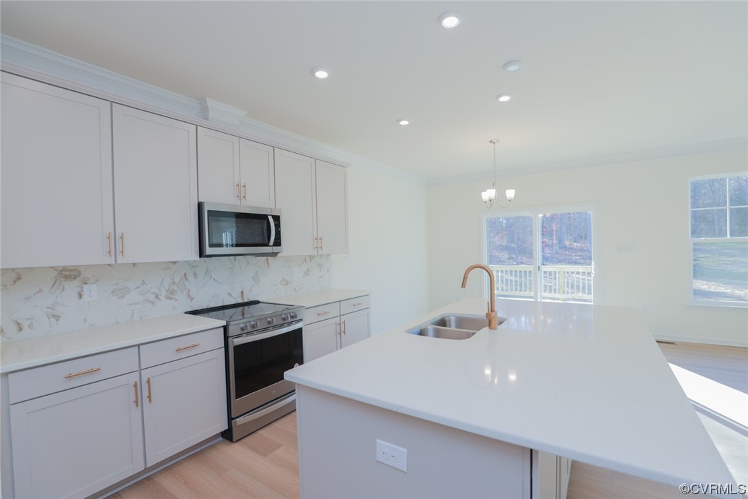 3843 Belspring Road Chester, VA 23831 - Photo 7 of 36 a kitchen with stainless steel appliances granite countertop a sink a stove top oven a counter space and cabinets
