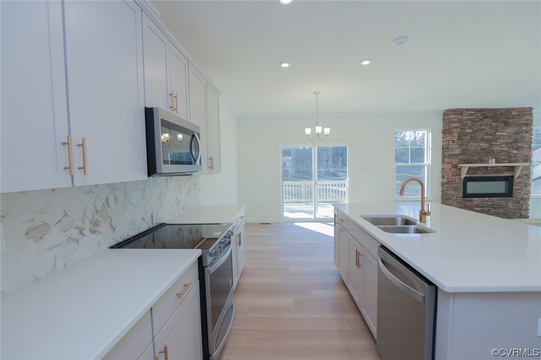 3843 Belspring Road Chester, VA 23831 - Photo 10 of 36 a kitchen with a sink and a stove top oven
