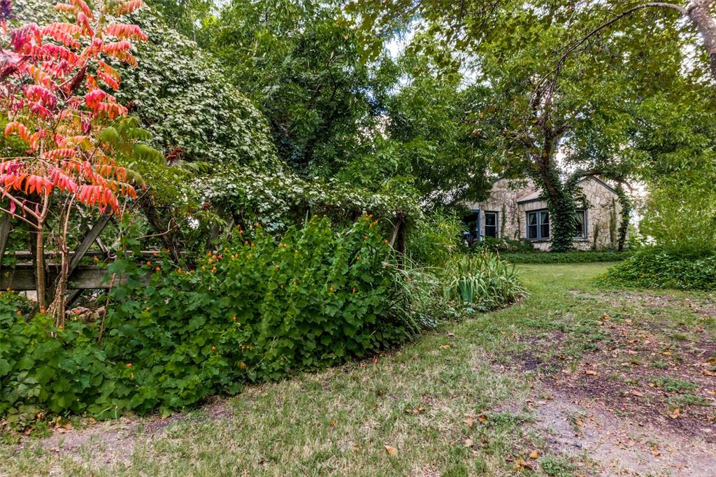 1226 East Campbell Road Garland, TX 75044 - Photo 12 of 14 a view of a house with a yard