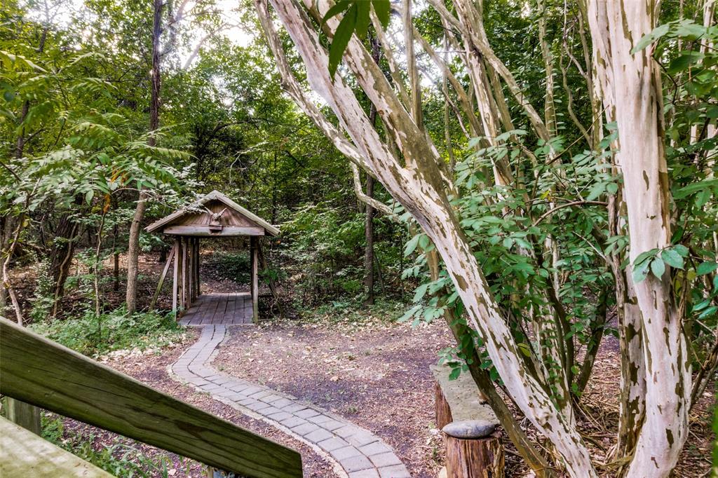 1226 East Campbell Road Garland, TX 75044 - Photo 8 of 14 a front view of a house with a yard