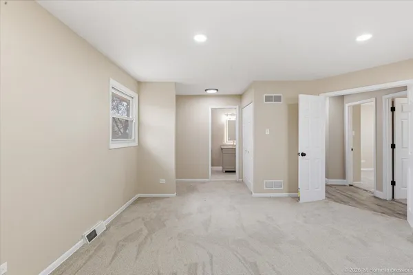 an empty room with a bathroom