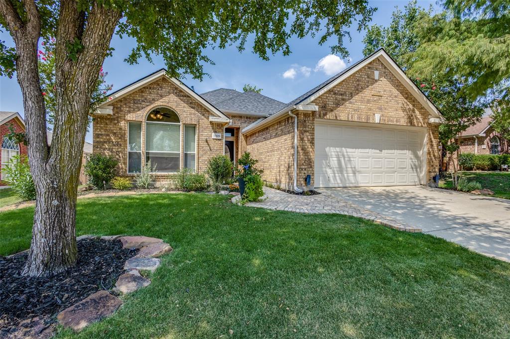1009 Ponderosa Ridge Little Elm, TX 75068 - Photo 1 of 1 a front view of a house with a yard and garage