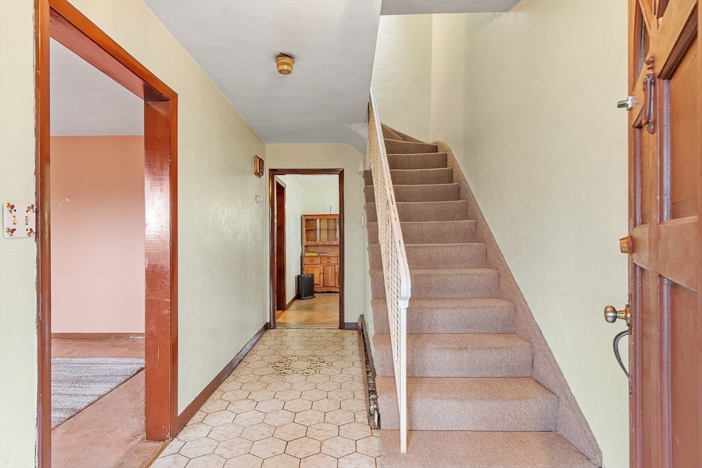 36 Florence Street Everett, MA 02149 - Photo 12 of 26 a view of a hallway with staircase