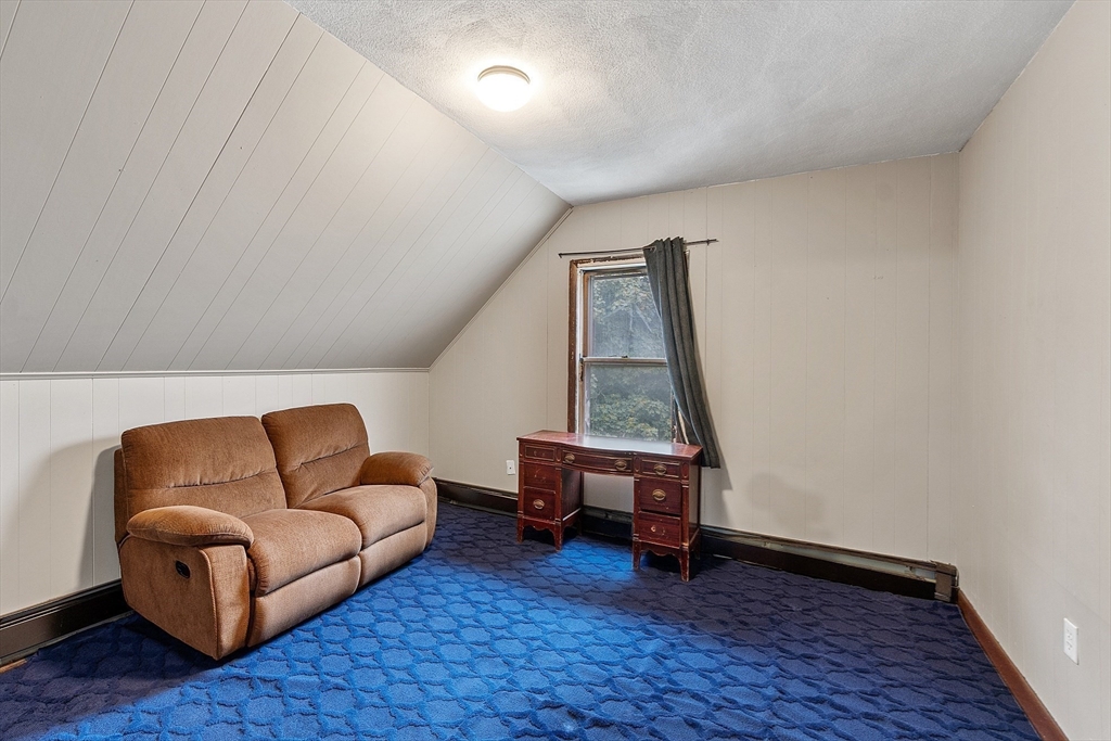 36 Florence Street Everett, MA 02149 - Photo 16 of 26 a living room with furniture and a wooden floor