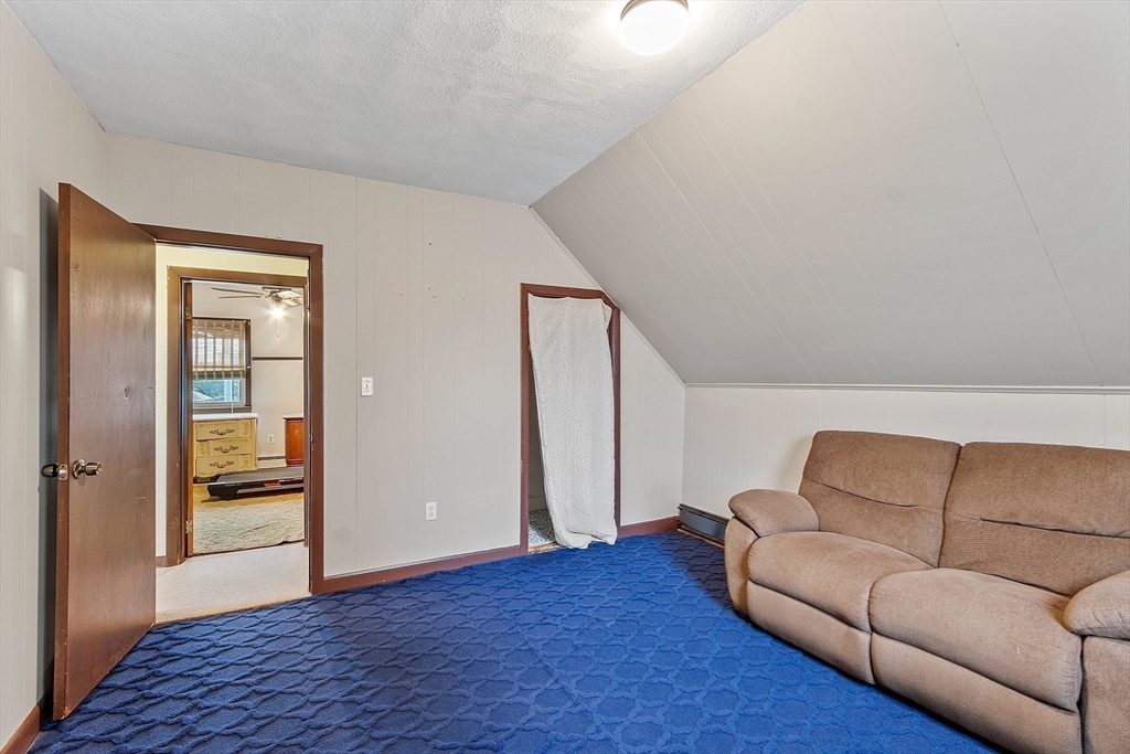36 Florence Street Everett, MA 02149 - Photo 17 of 26 a living room with furniture and a gate