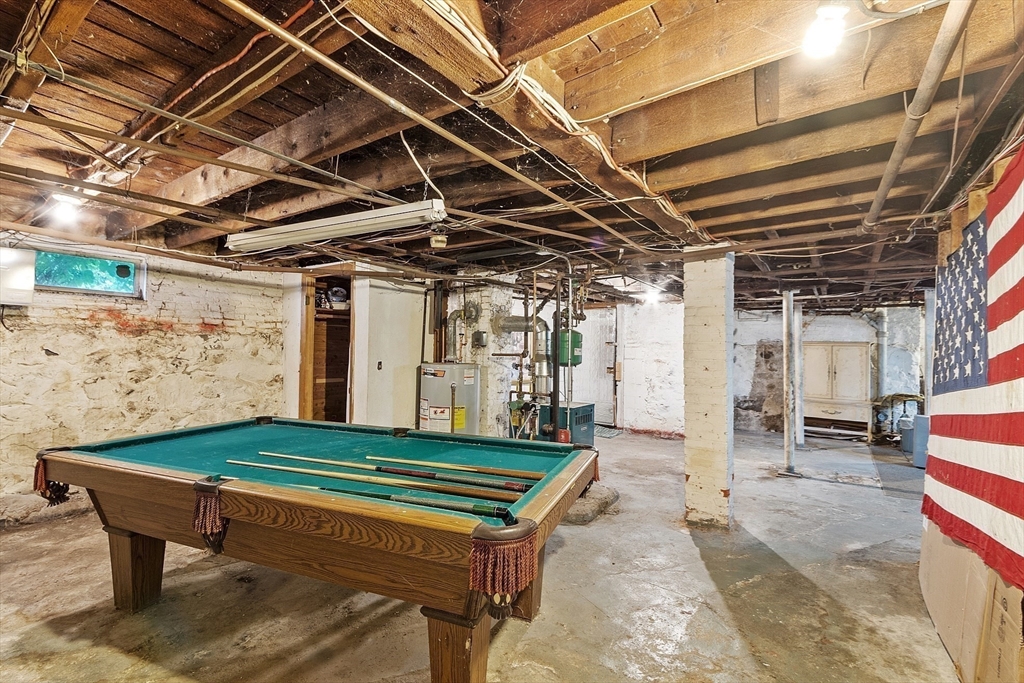 36 Florence Street Everett, MA 02149 - Photo 21 of 26 a backyard of a house with barbeque oven table and chairs