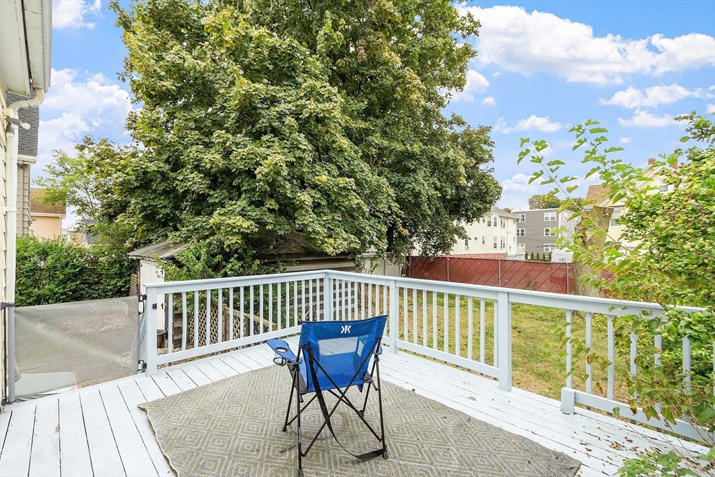 36 Florence Street Everett, MA 02149 - Photo 25 of 26 a view of a chair and table on the wooden floor