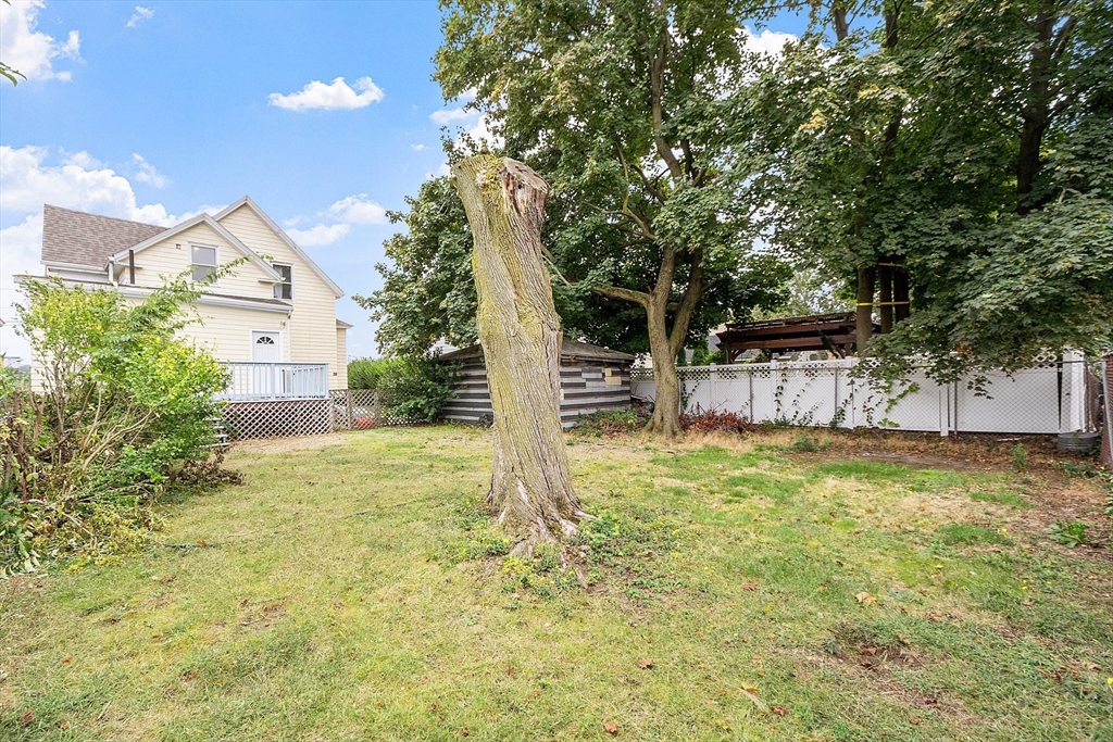 36 Florence Street Everett, MA 02149 - Photo 26 of 26 a backyard of a house with table and chairs