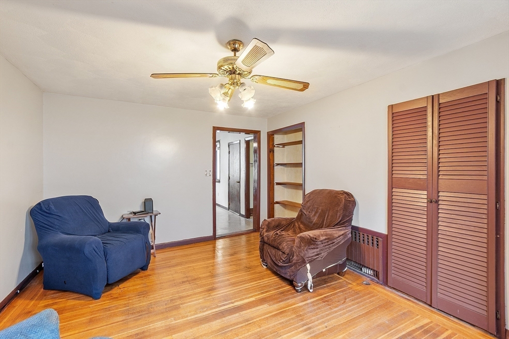 36 Florence Street Everett, MA 02149 - Photo 8 of 26 a living room with furniture and a rug